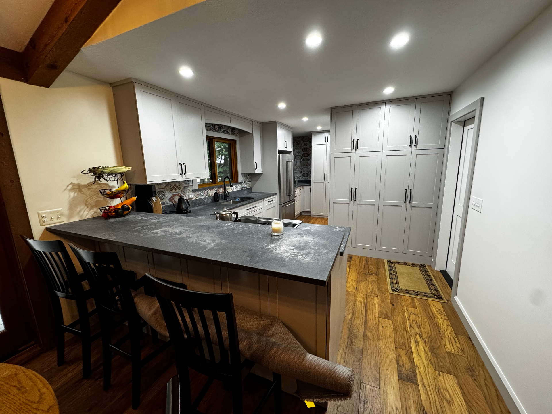 Custom kitchen remodel with island seating and tall cabinetry