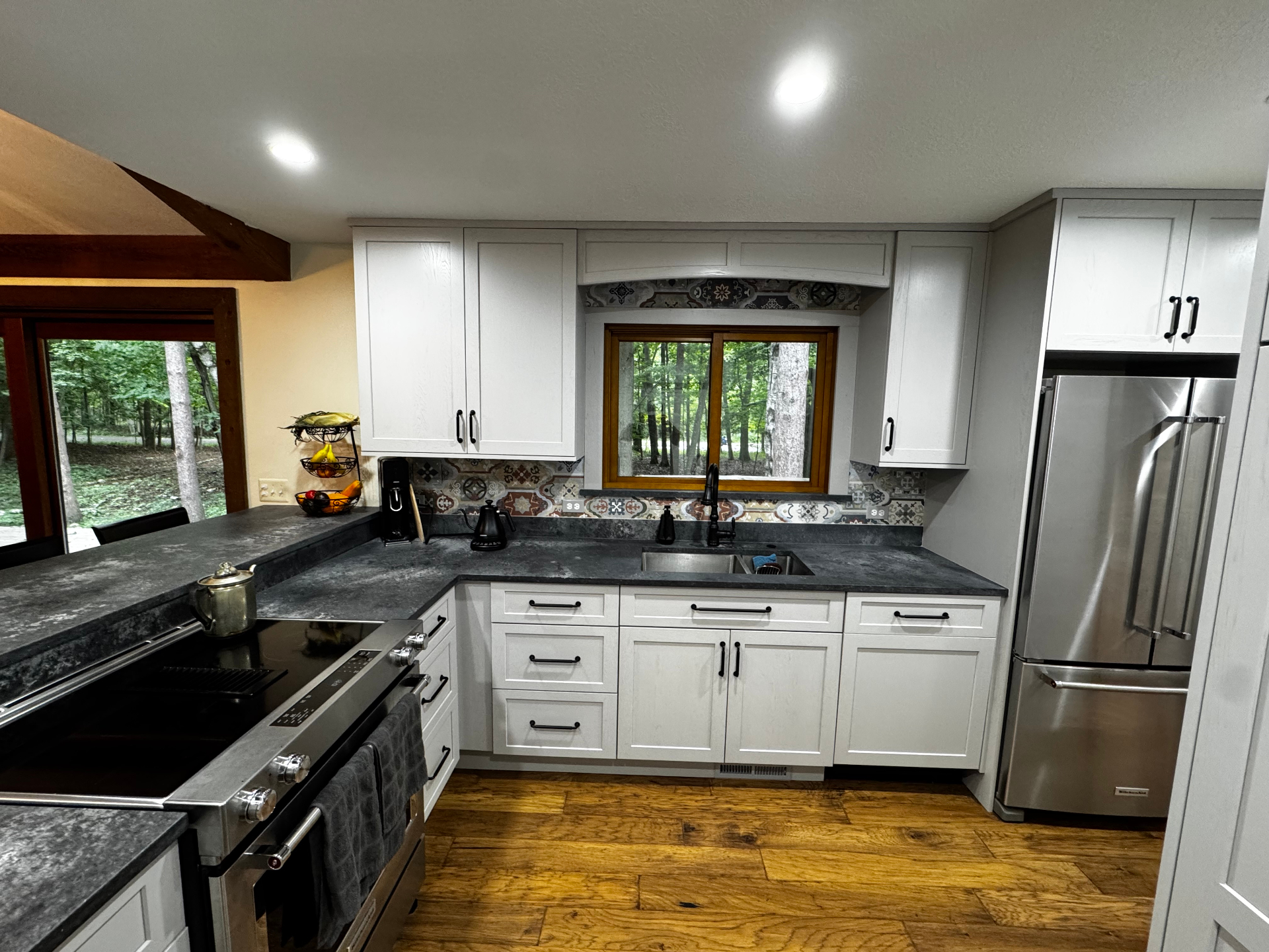 Custom kitchen remodel with white cabinetry